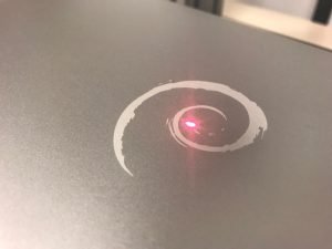 Laser engraving logos on notebook